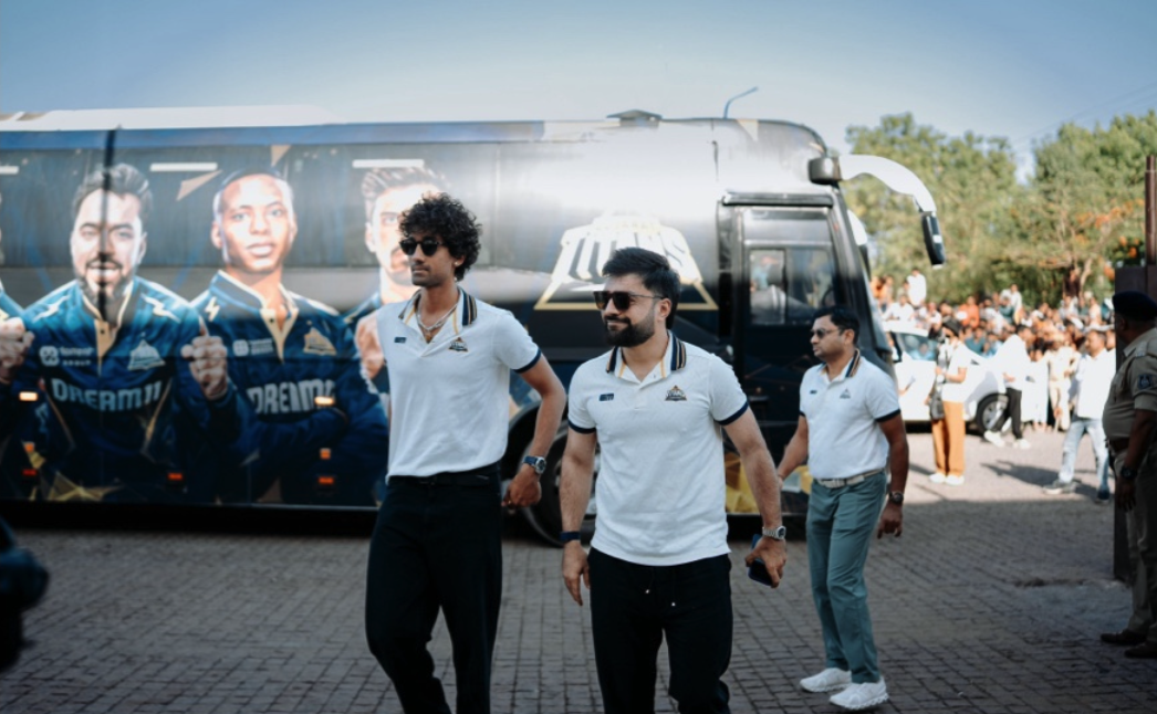 Players walking by the Gujarat Titans team bus