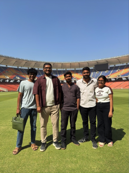 Production crew on the field inside the stadium