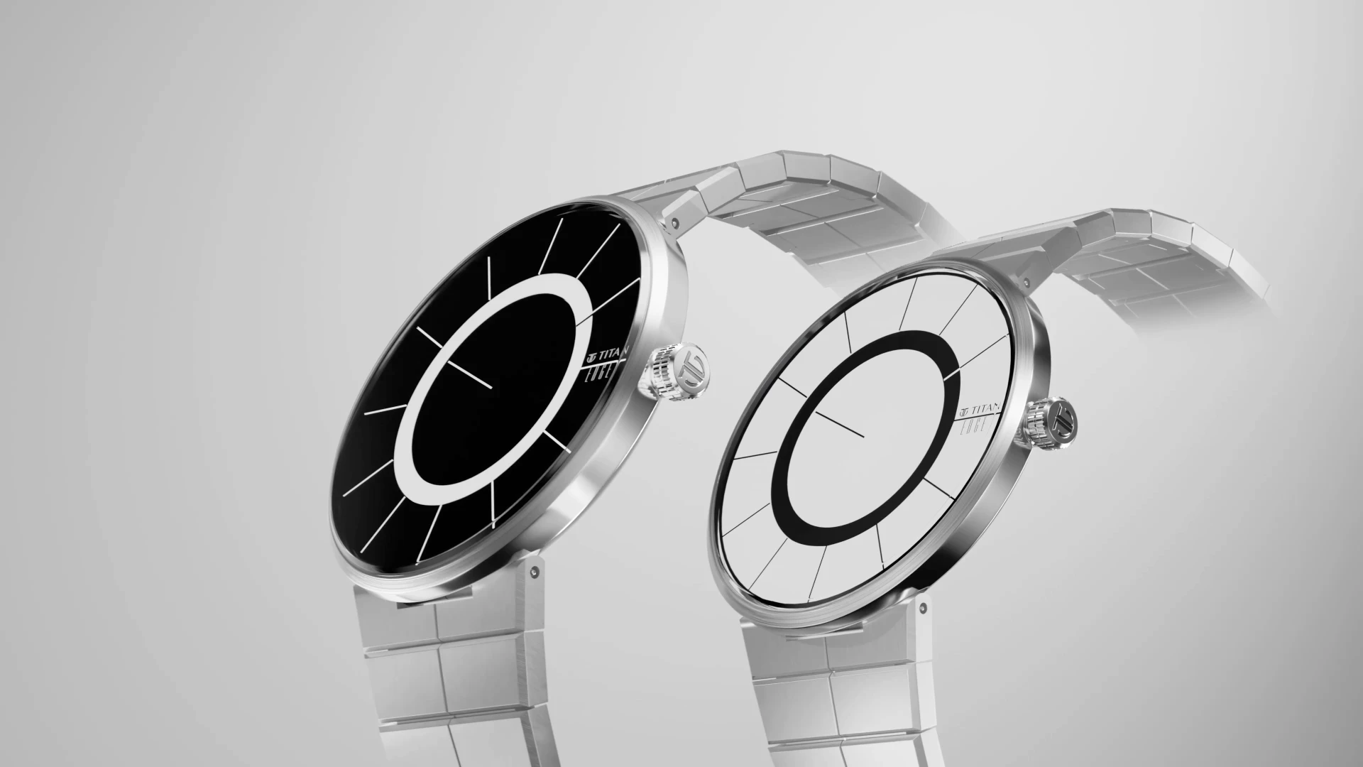 Two Edge watches, black and white dials, in a light sweep